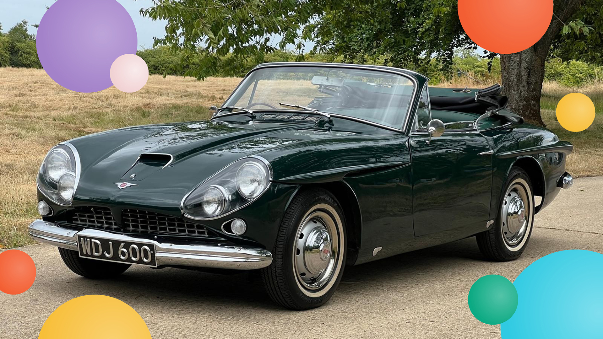A green vintage two seater sports car